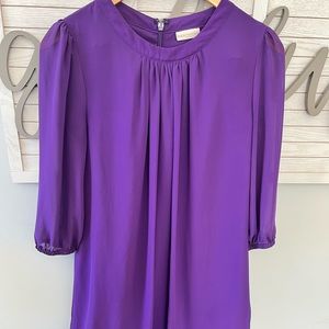 Adorable dress. See through sleeves.